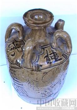 明清。青釉剔花文饰罐-收藏网